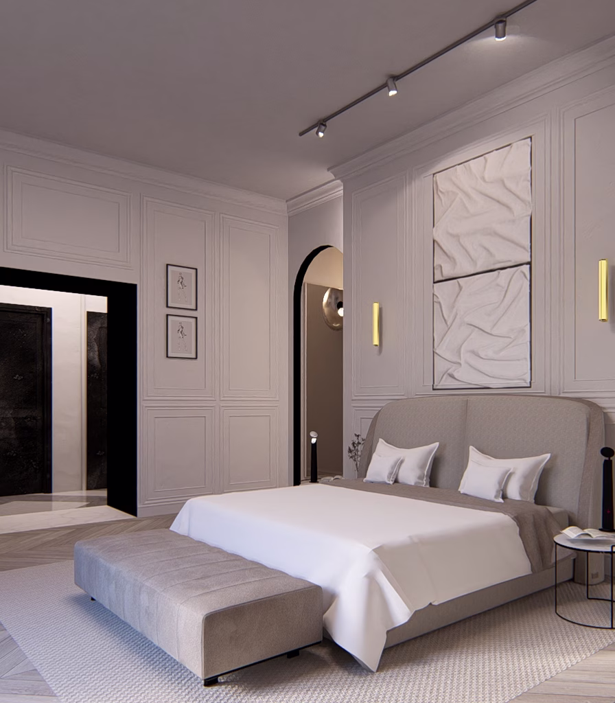 Camera da letto con boiserie chiara, letto imbottito e illuminazione a binario.