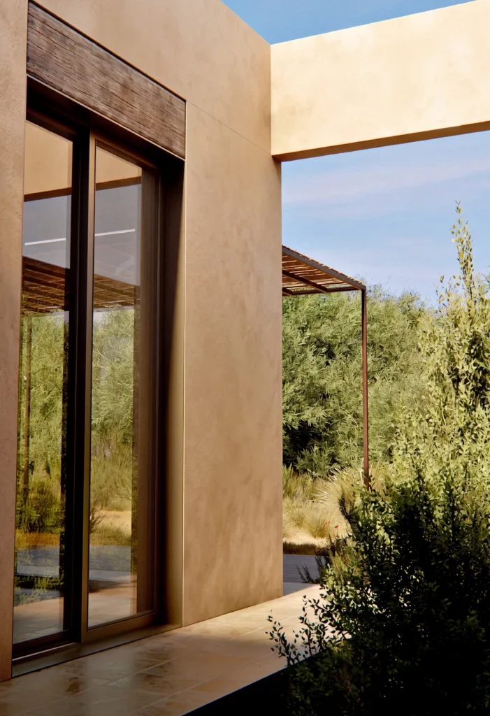 Dettaglio architettonico dell'infisso minimale con architrave in legno grezzo e intonaco a calce di una villa di lusso.